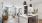 Modern open-concept living area featuring a bright living room with large windows, a sleek kitchen island, and elegant pendant lighting at The Rowley in Murfreesboro