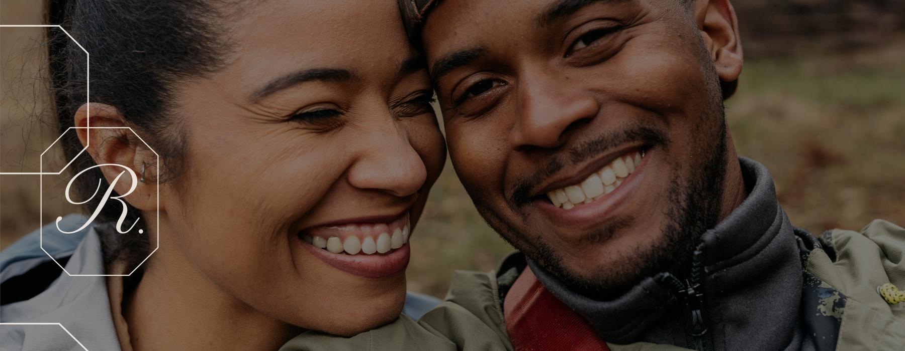 a man and a woman smiling